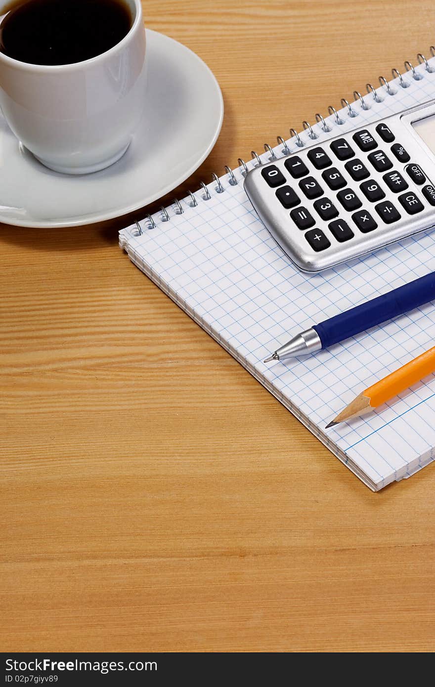 Notepad and coffee at table