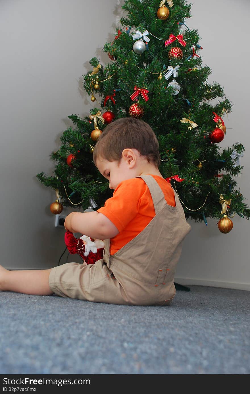 Baby sitting under the Christmas tree