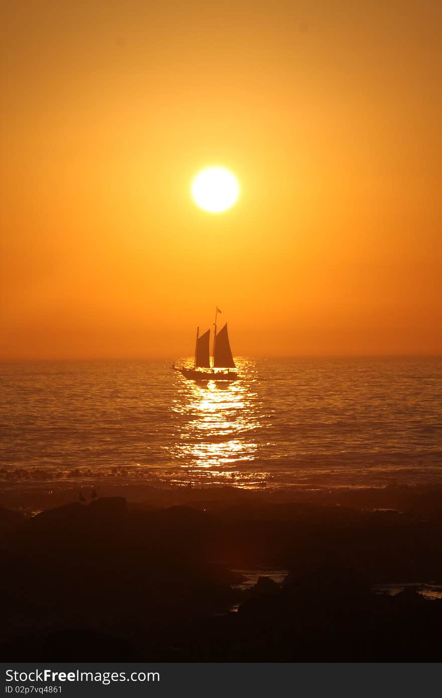 Boat in the sunset at Sea point, Cape Town, South Africa. Boat in the sunset at Sea point, Cape Town, South Africa