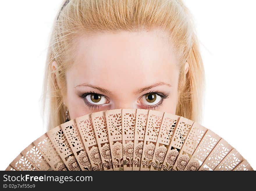 Young beautiful blond girl with a fan