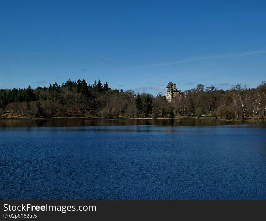 Looking across the lake towards the Chateaux at Sedieres in the correze are of Limousin France. Looking across the lake towards the Chateaux at Sedieres in the correze are of Limousin France