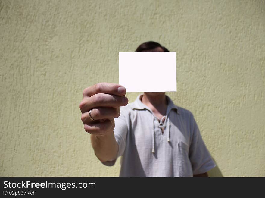 White card in a man's hand