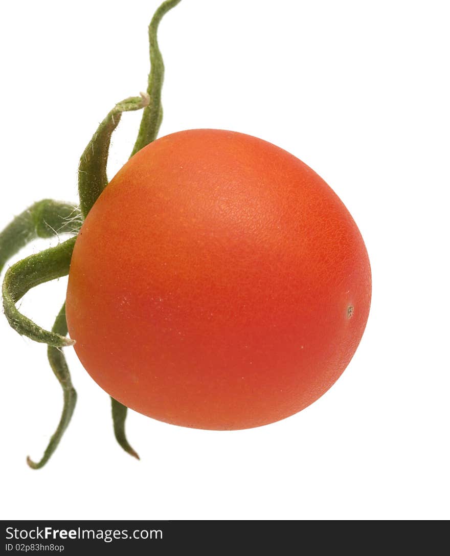 Red tomato close up it is isolated on a white background. Red tomato close up it is isolated on a white background.