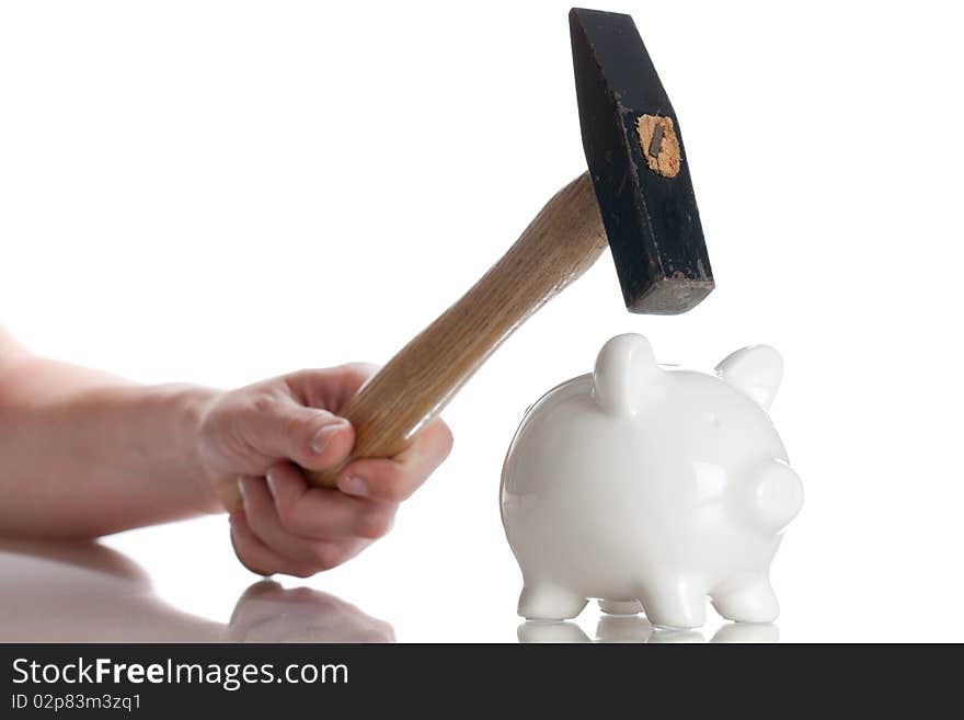 Piggy Bank and a hammer isolated on a white backgorund