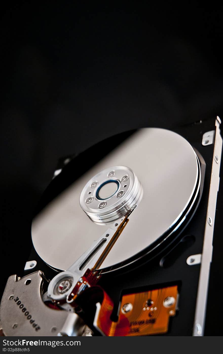 Open hard disk on a black background