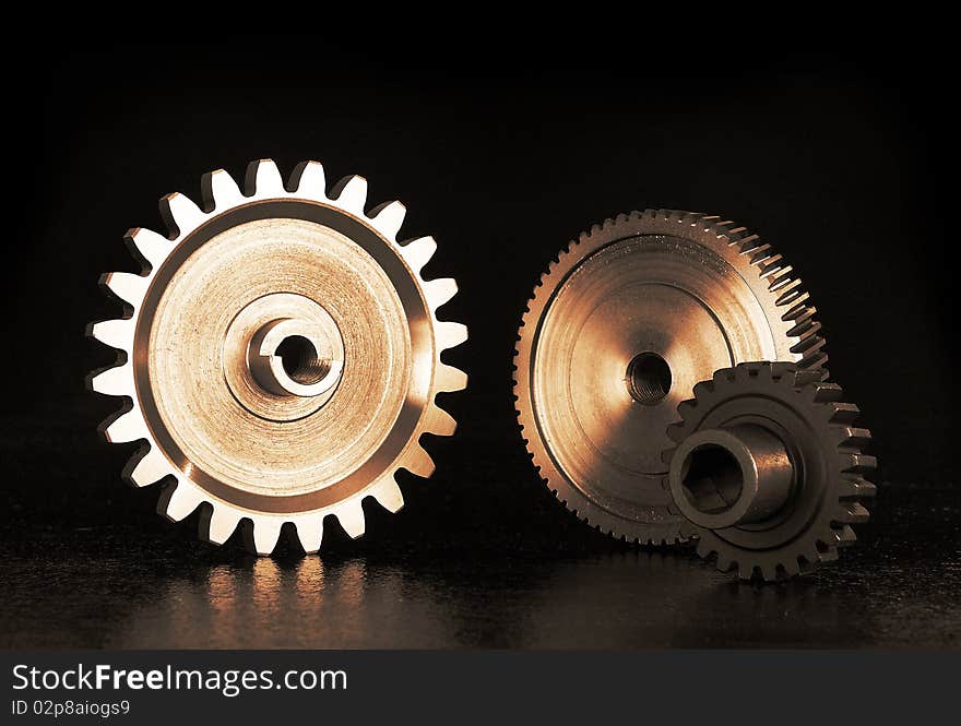 Still life of gears on black background