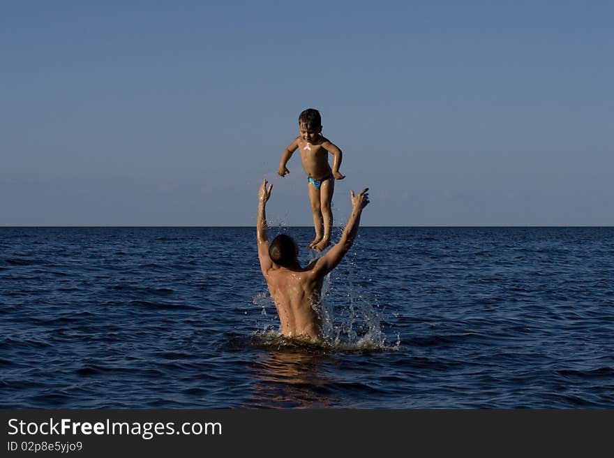 FATHER HOLDING BABY UP HIGH. FATHER HOLDING BABY UP HIGH