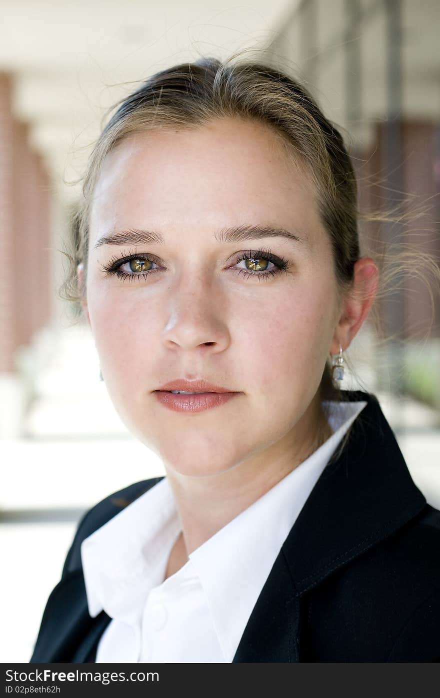 Attractive businesswoman looking at camera