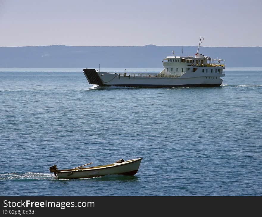 Ship traffic in Adriatic sea . Two ships, catamaran and small boat in different directions, traveling by sea.