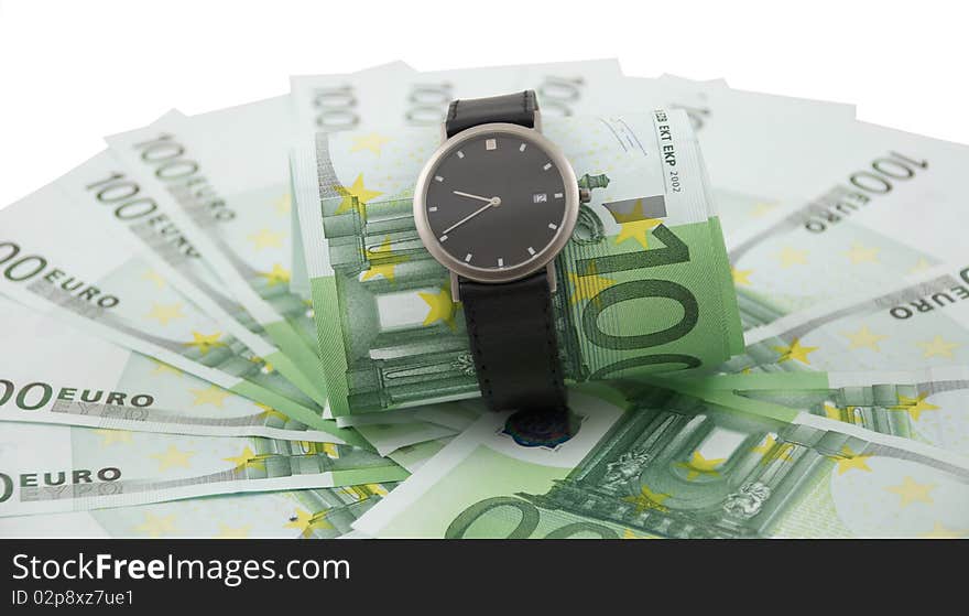 Watch and 100 euros isolated on a white.