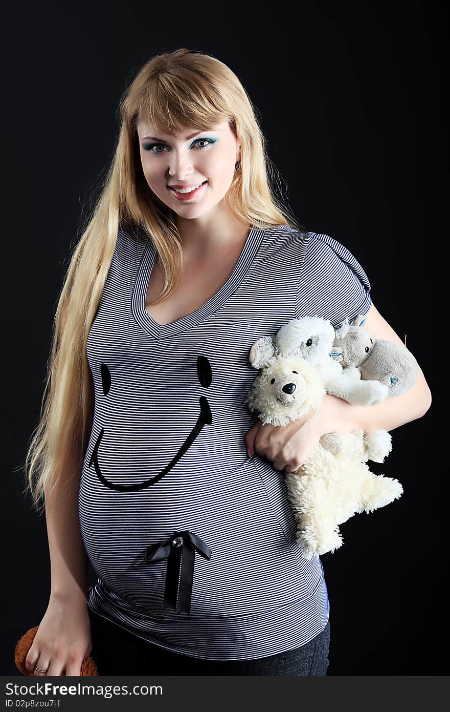 Portrait of pregnant woman posing against black  background. Portrait of pregnant woman posing against black  background.