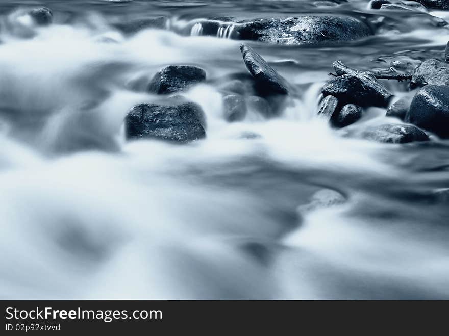 Abstract cold water run on the rocks. Abstract cold water run on the rocks