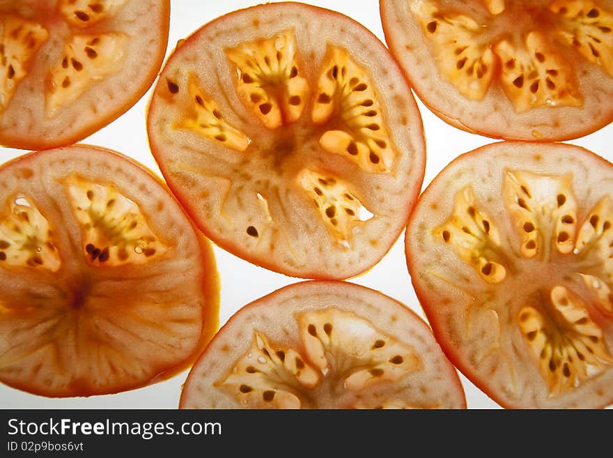 Slices of tomato isolated over the white background