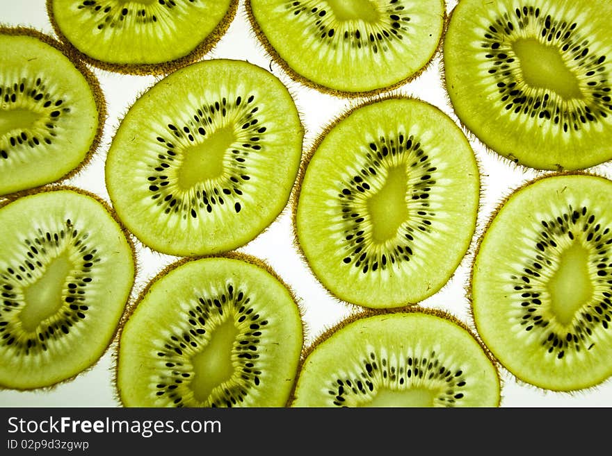 Slices of kiwi isolated over the white background