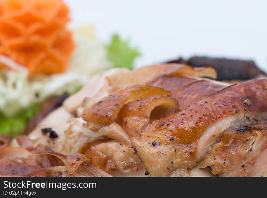 Roasted chicken decorate with carrot and vegetable close up