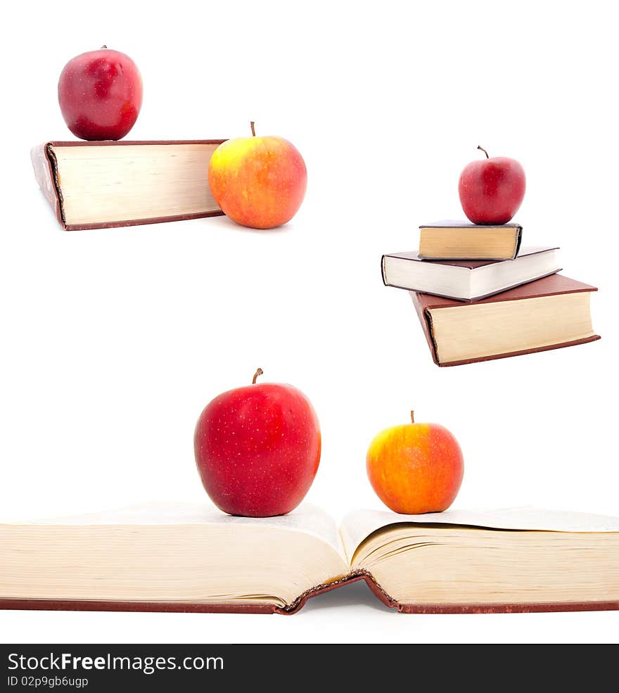 Set of the thick books and apples on a white background