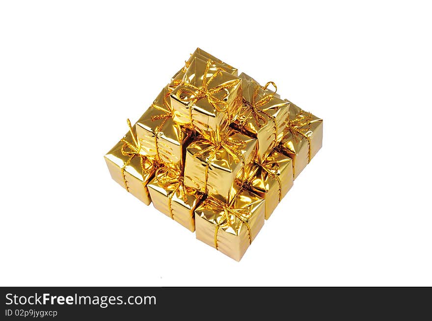 Isolated pyramid of small yellow gifts on white. Isolated pyramid of small yellow gifts on white