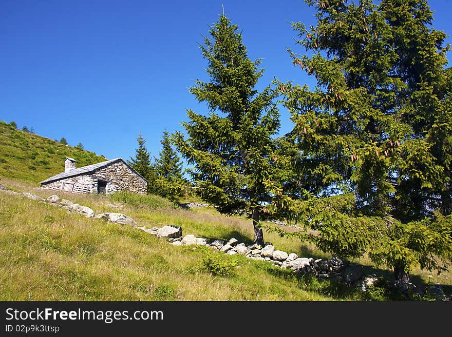 Mountain house in the middle of the lawn. Mountain house in the middle of the lawn