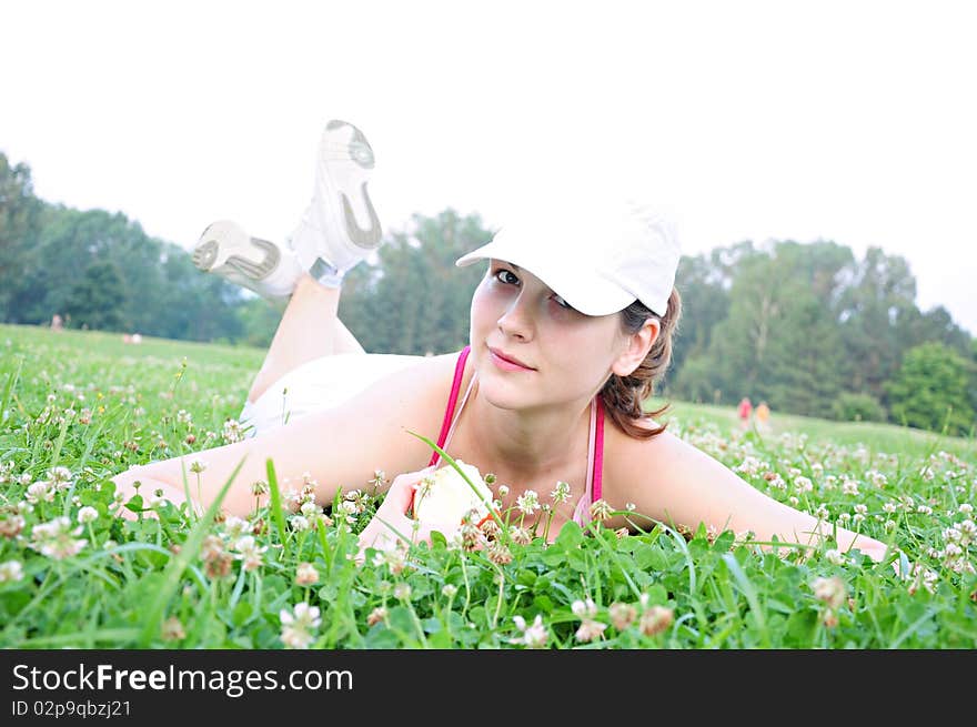 Girl eating an apple in nature