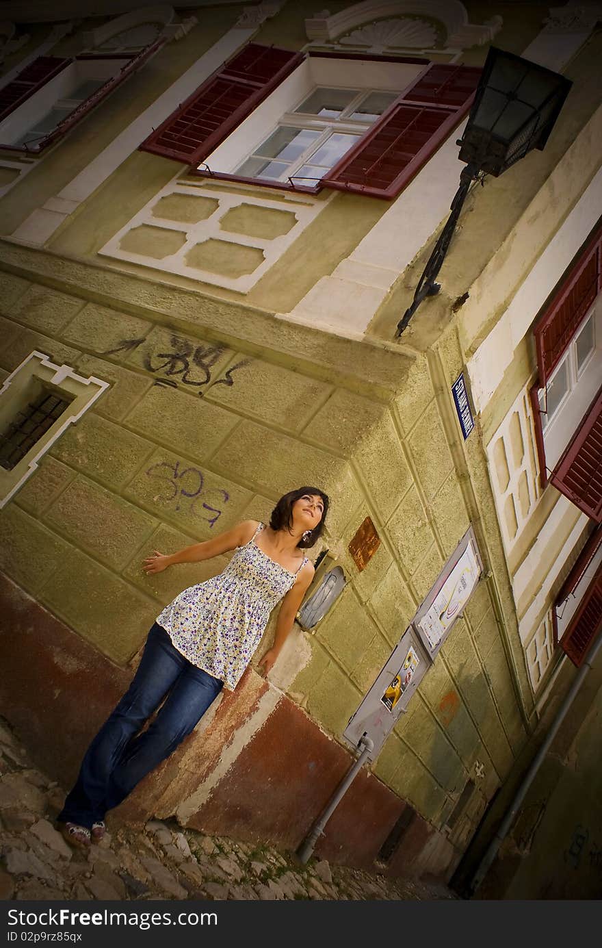 Young beautiful girl posing in the city. Young beautiful girl posing in the city