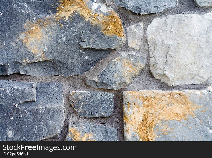 A close up of a stone and mortar wall. A close up of a stone and mortar wall