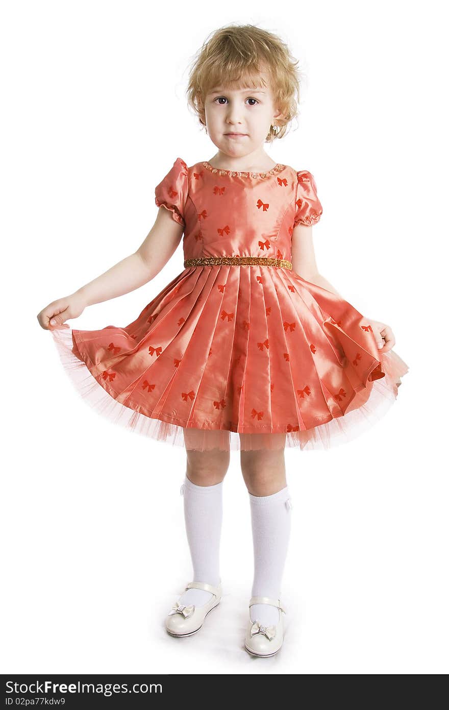 The little girl in dressing-up dress full Length. On a white background. The little girl in dressing-up dress full Length. On a white background.