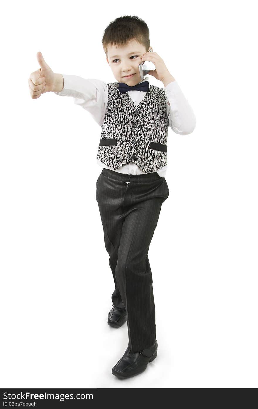 Serious boy with thumbs up on white background. Serious boy with thumbs up on white background