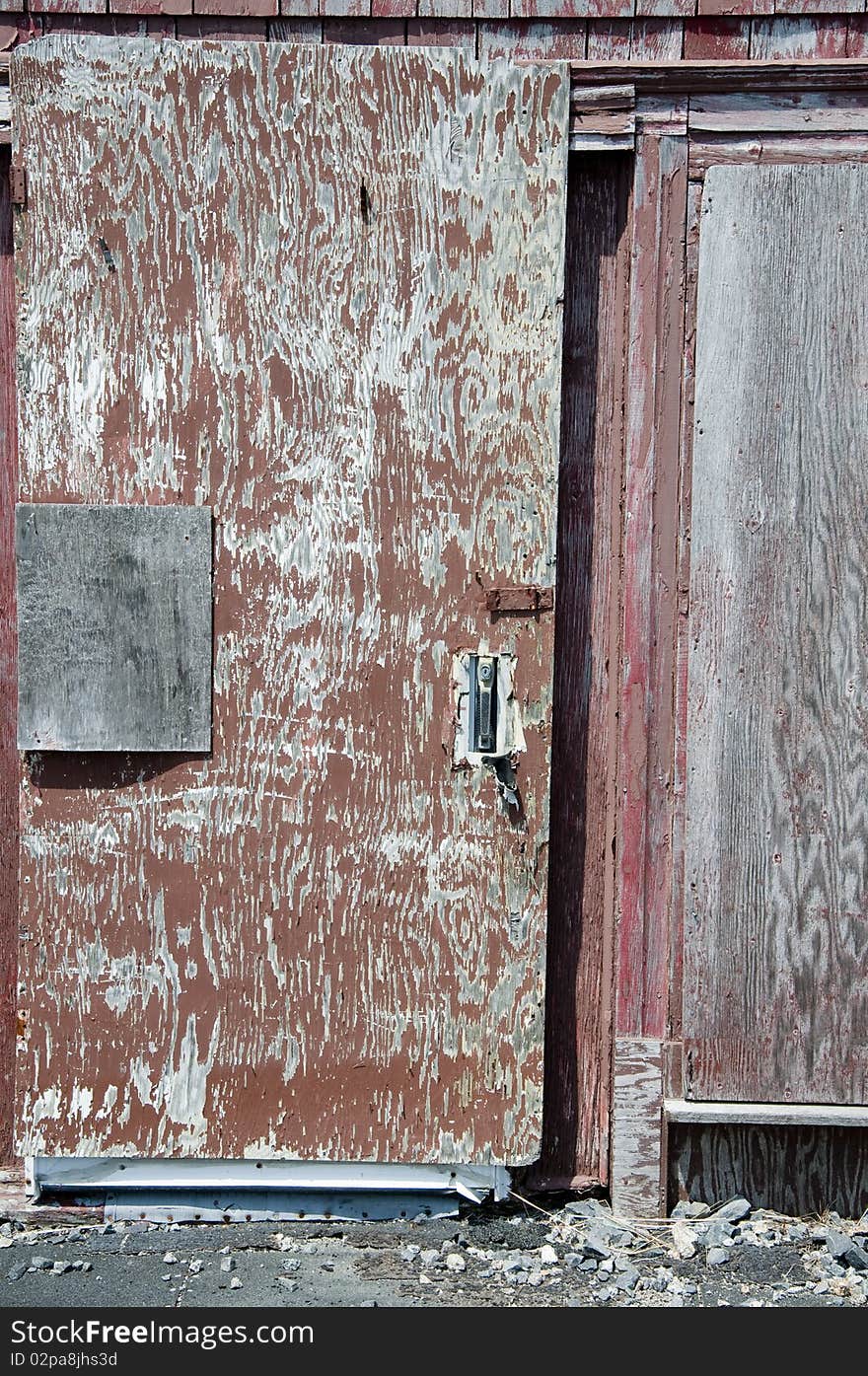 A door on an old shed at Peggy's Cove in Canada. A door on an old shed at Peggy's Cove in Canada.