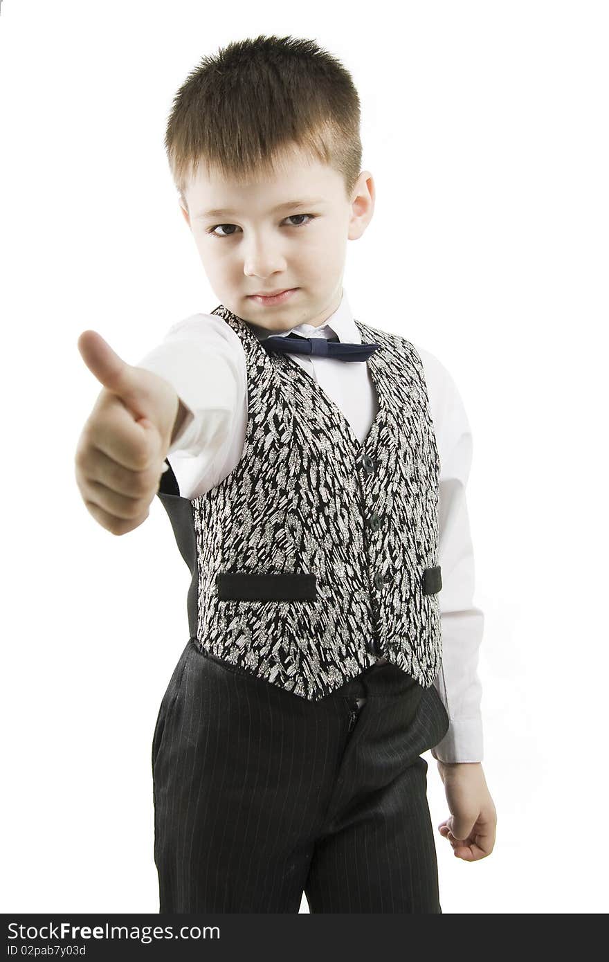 Serious boy with thumbs up on white background. Serious boy with thumbs up on white background