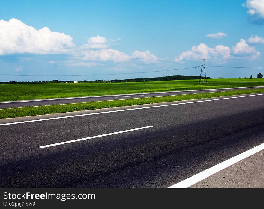 Part of the asphalted road with a road marking