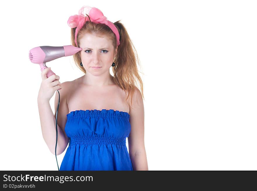 Red-haired girl with the hair dryer. Isolated over white .