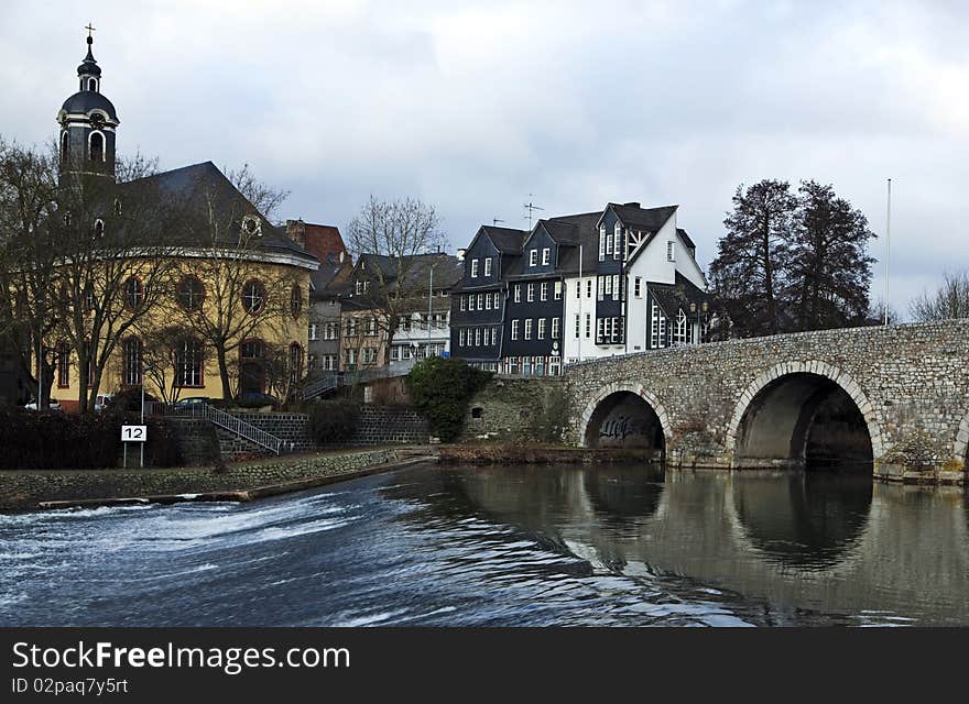 View across the river with an old church in the background. View across the river with an old church in the background