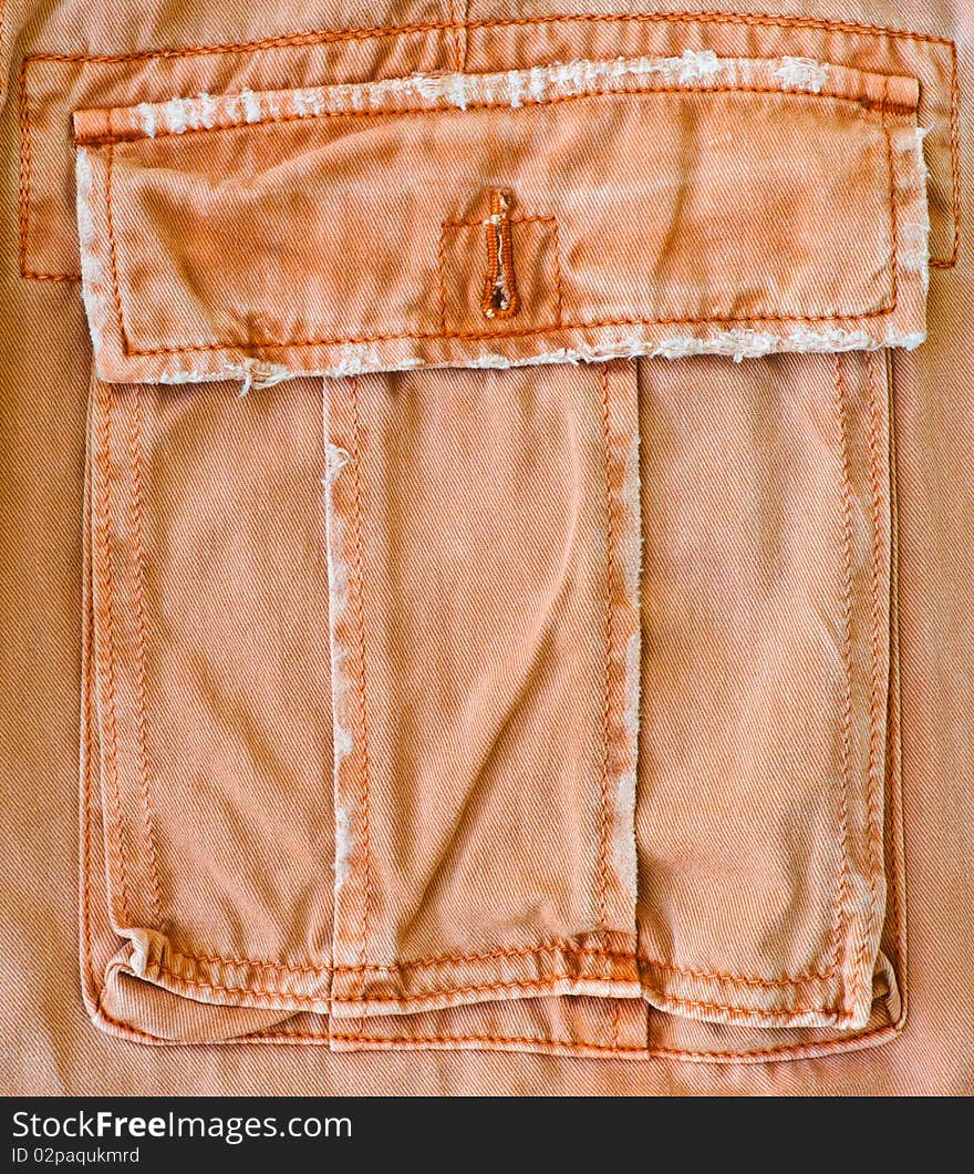 An orange pant's pocket as a background