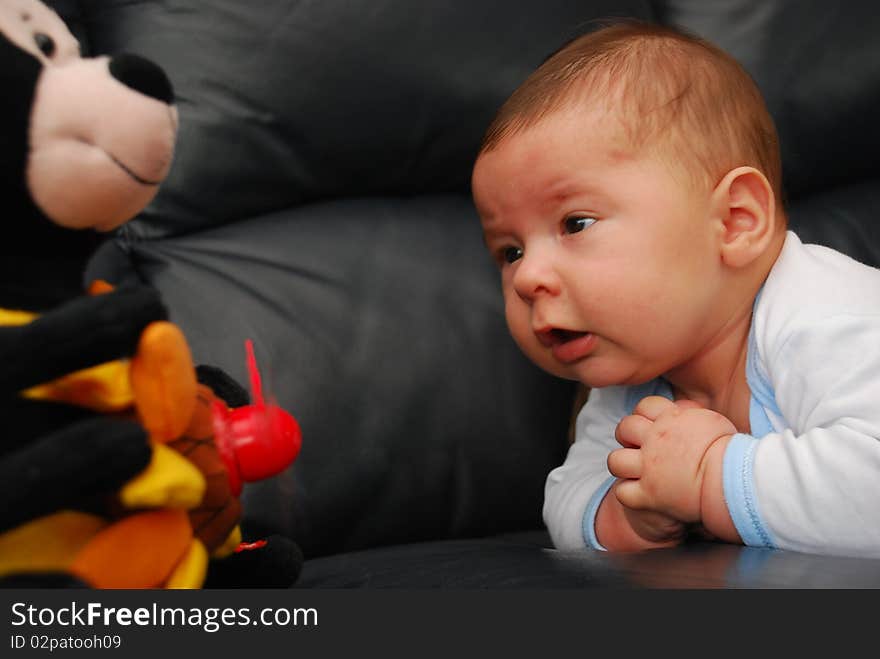 Relaxing Small Baby With A Toy