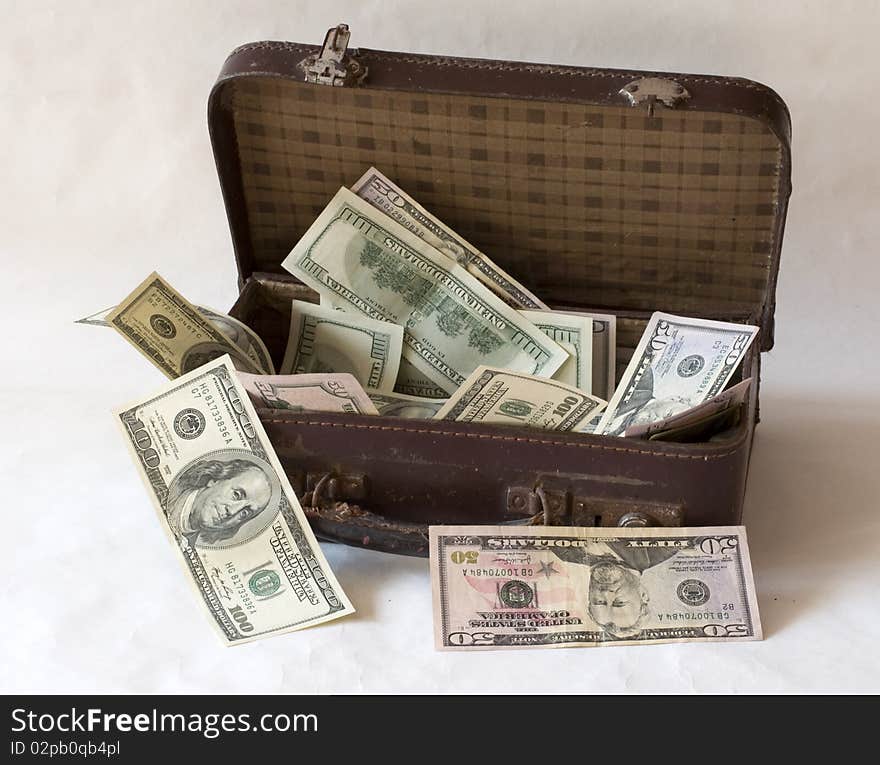 Dollars are in a suitcase