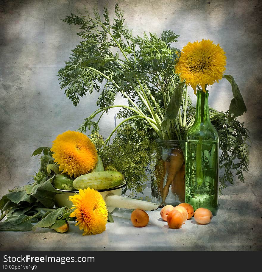 Still life with sunflowers and cucumbers