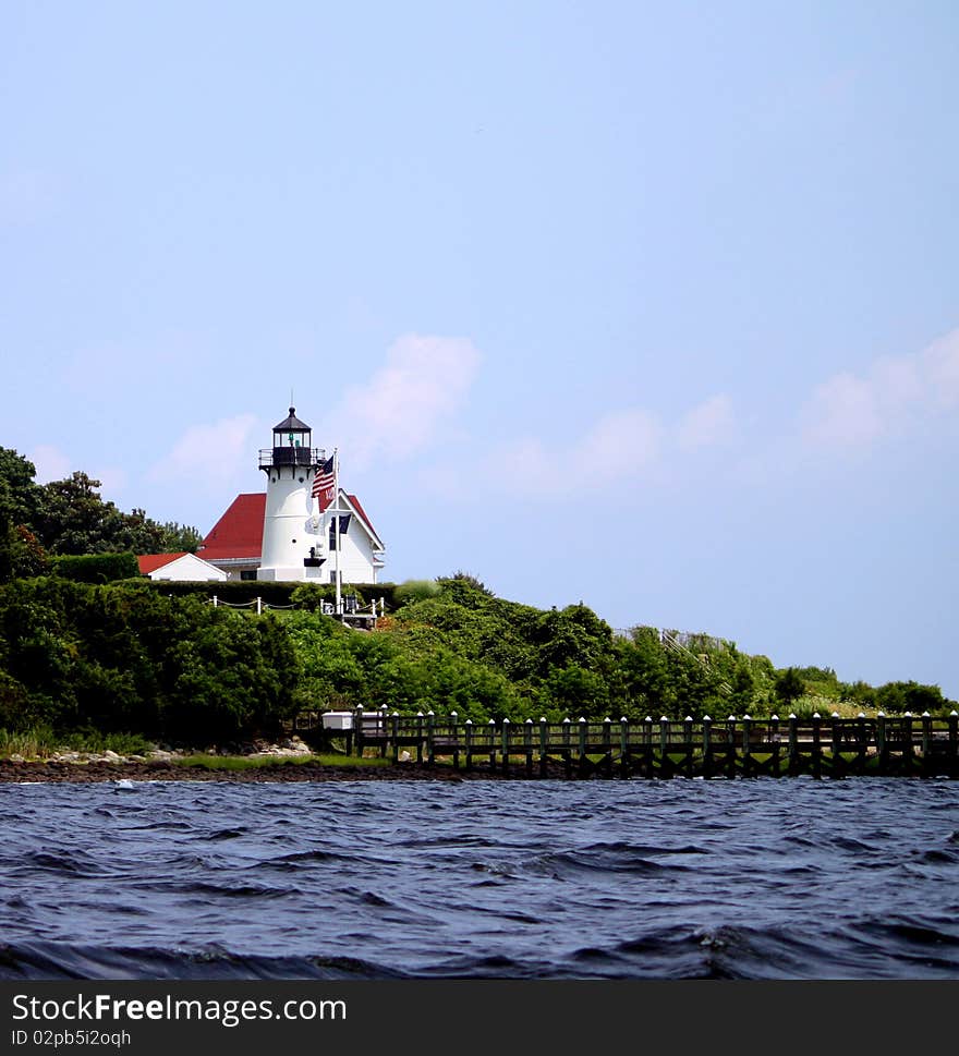 Lighthouse with red roof and copy space. Lighthouse with red roof and copy space