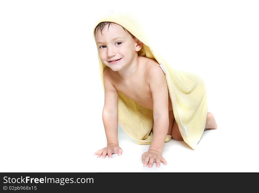 Cute boy in towel after bath over white