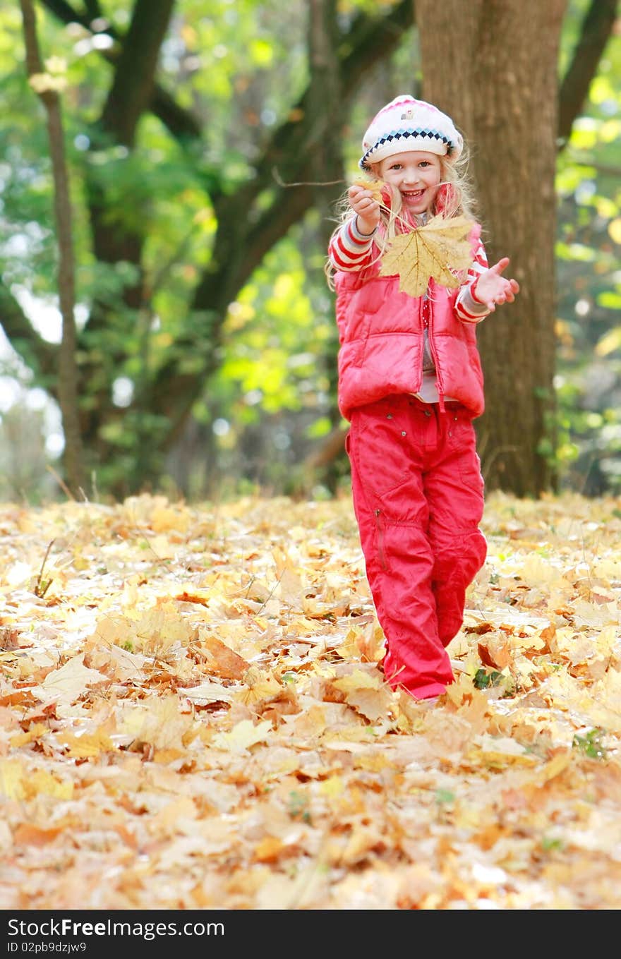 Young Happy Girl In Autumn Park