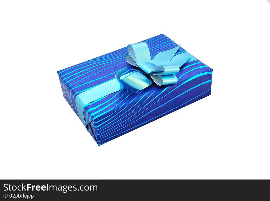 Isolated blue gift with a bow and ribbon. Isolated blue gift with a bow and ribbon