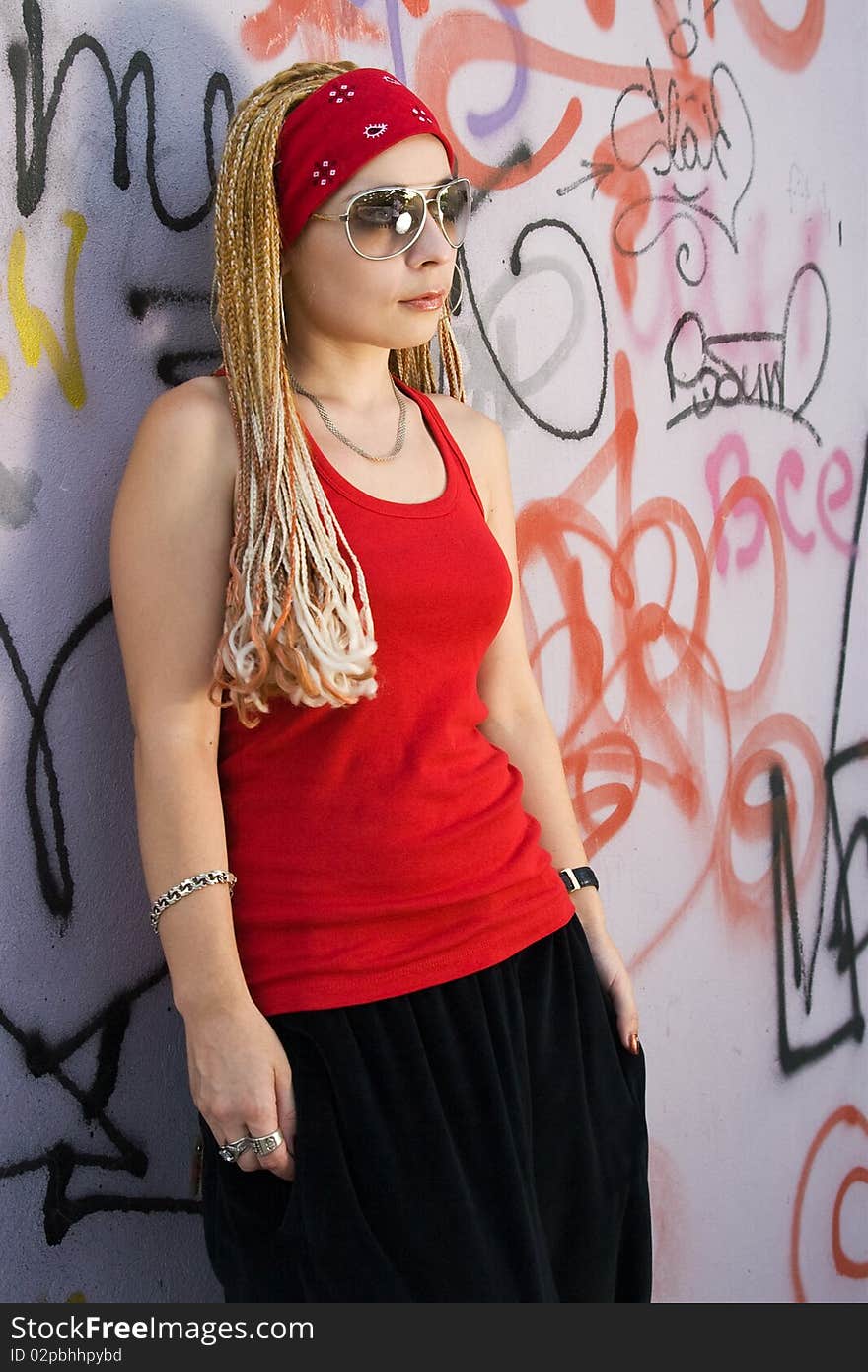 Rapper Girl Posing At Sprayed Wall