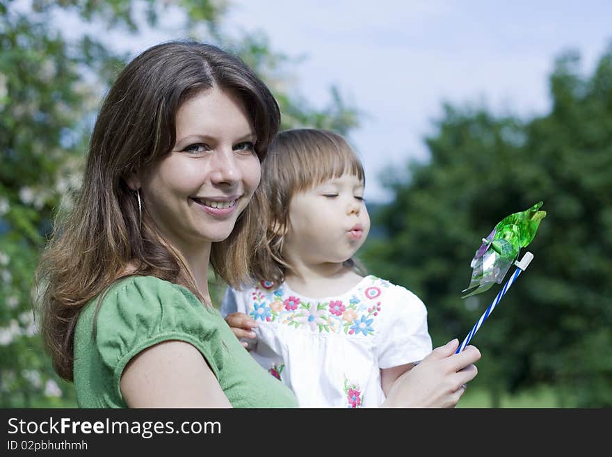 Mother with daughter playing in park