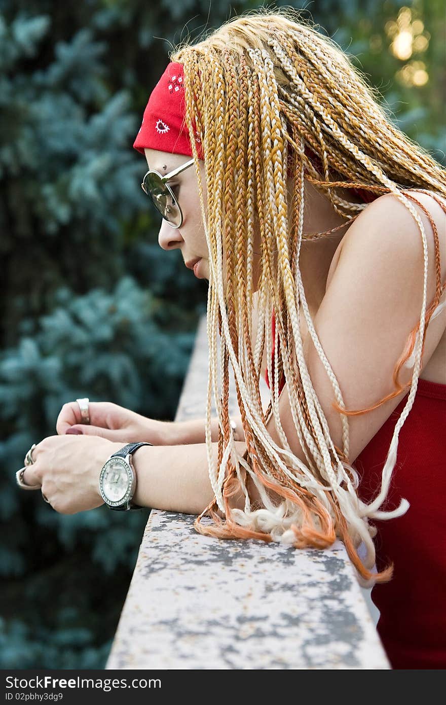Late teenage girl with braids posing outdoors. Late teenage girl with braids posing outdoors