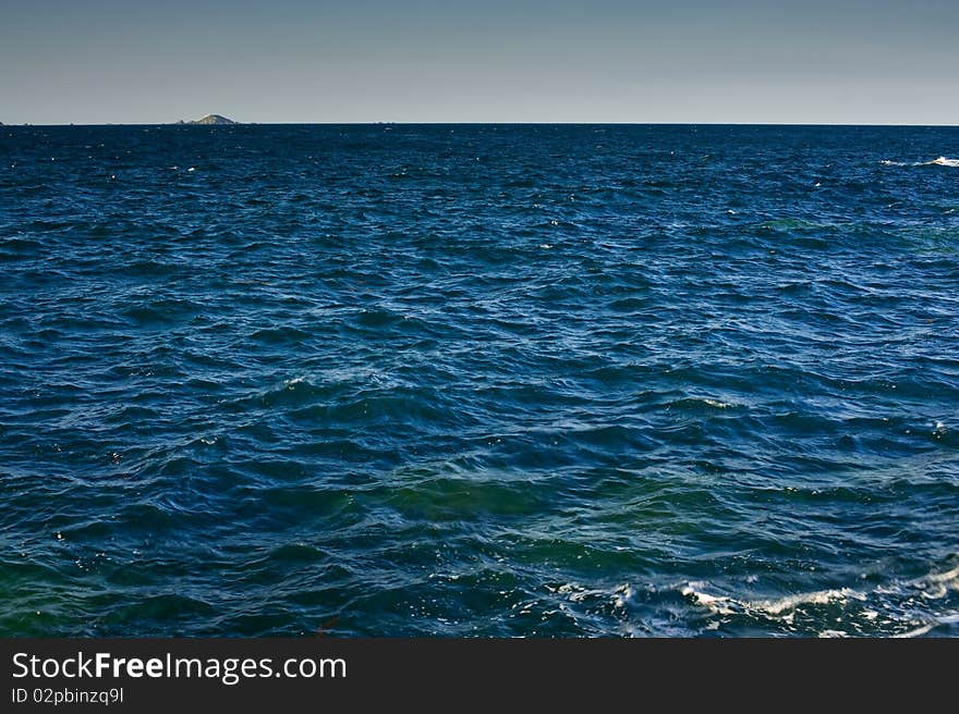 Ocean Horizon With Island