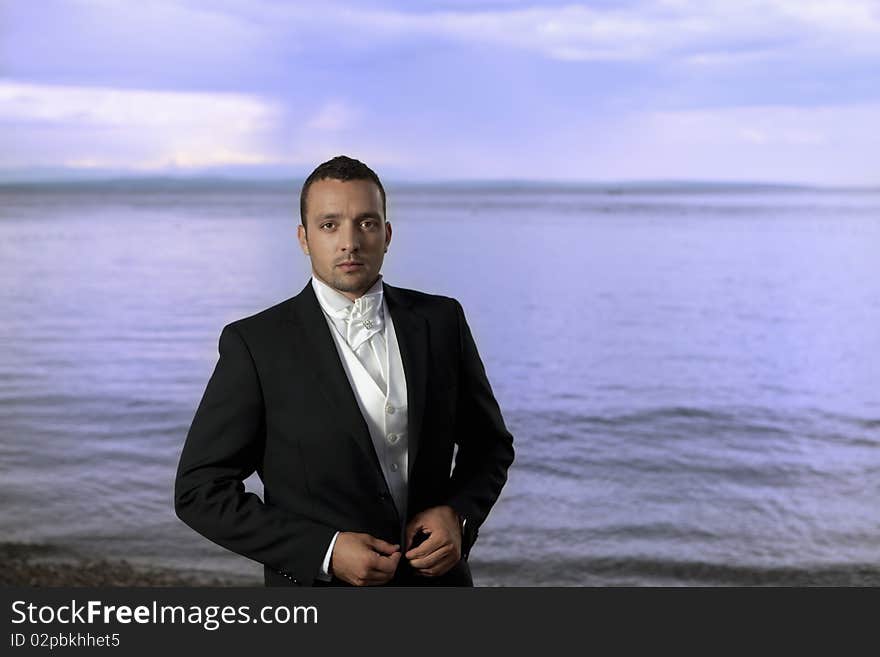 Young groom in wedding suit