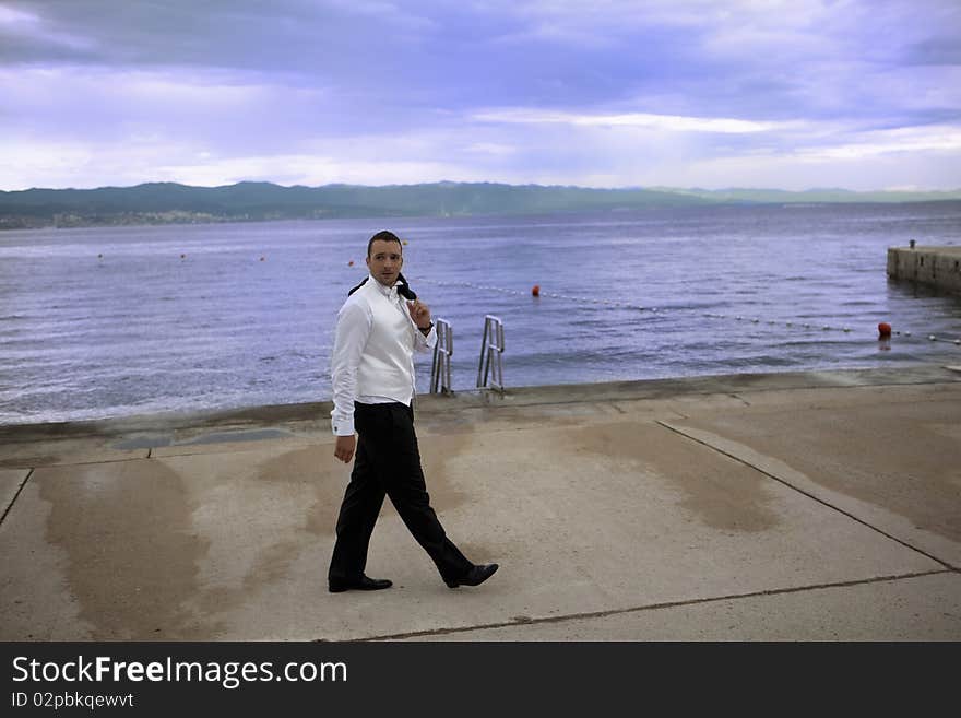 Young groom in wedding suit