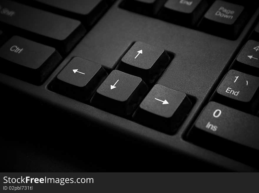 A close-up of arrow keys on a Keyboard.