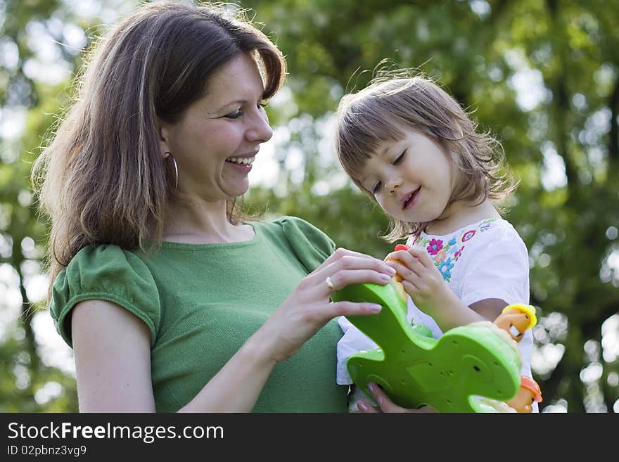 Beautiful mother and daughter playing together