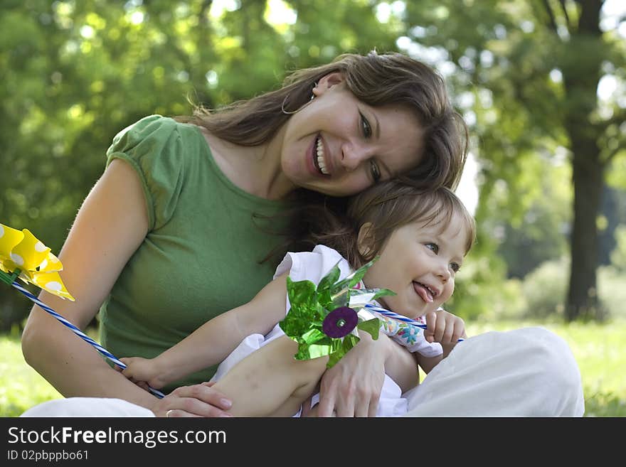 Beautiful mother and daughter playing together