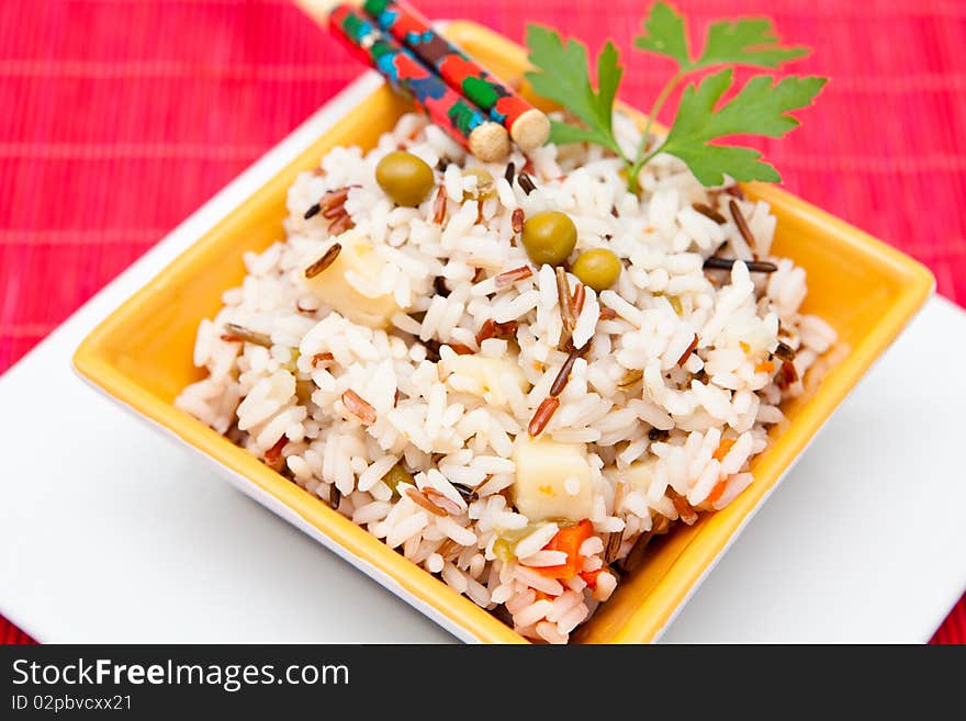 Asian rice salad on a bowl with vegetables